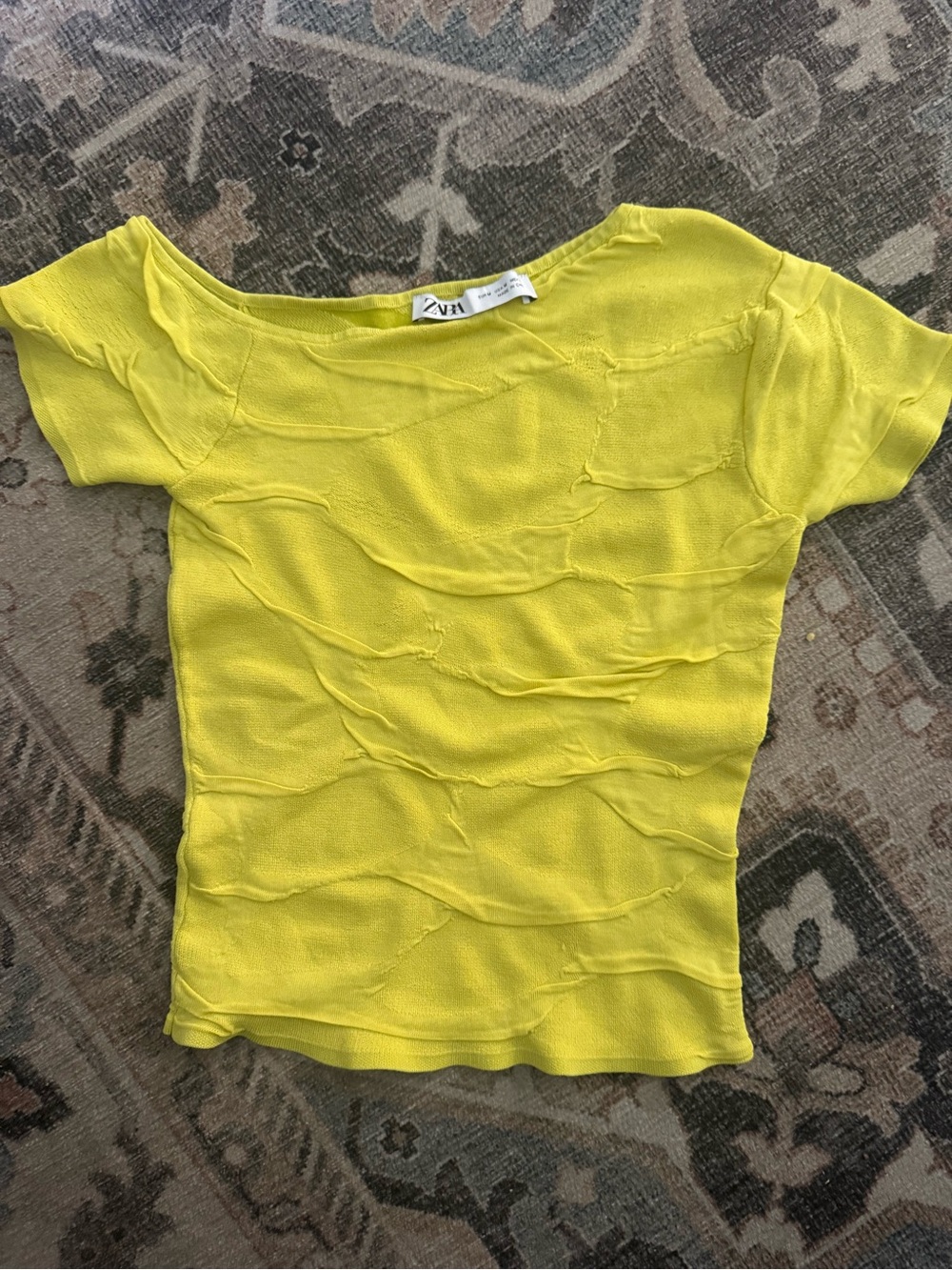 Zara asymmetrical lemon yellow knit crop top with a textured, wrinkled design.